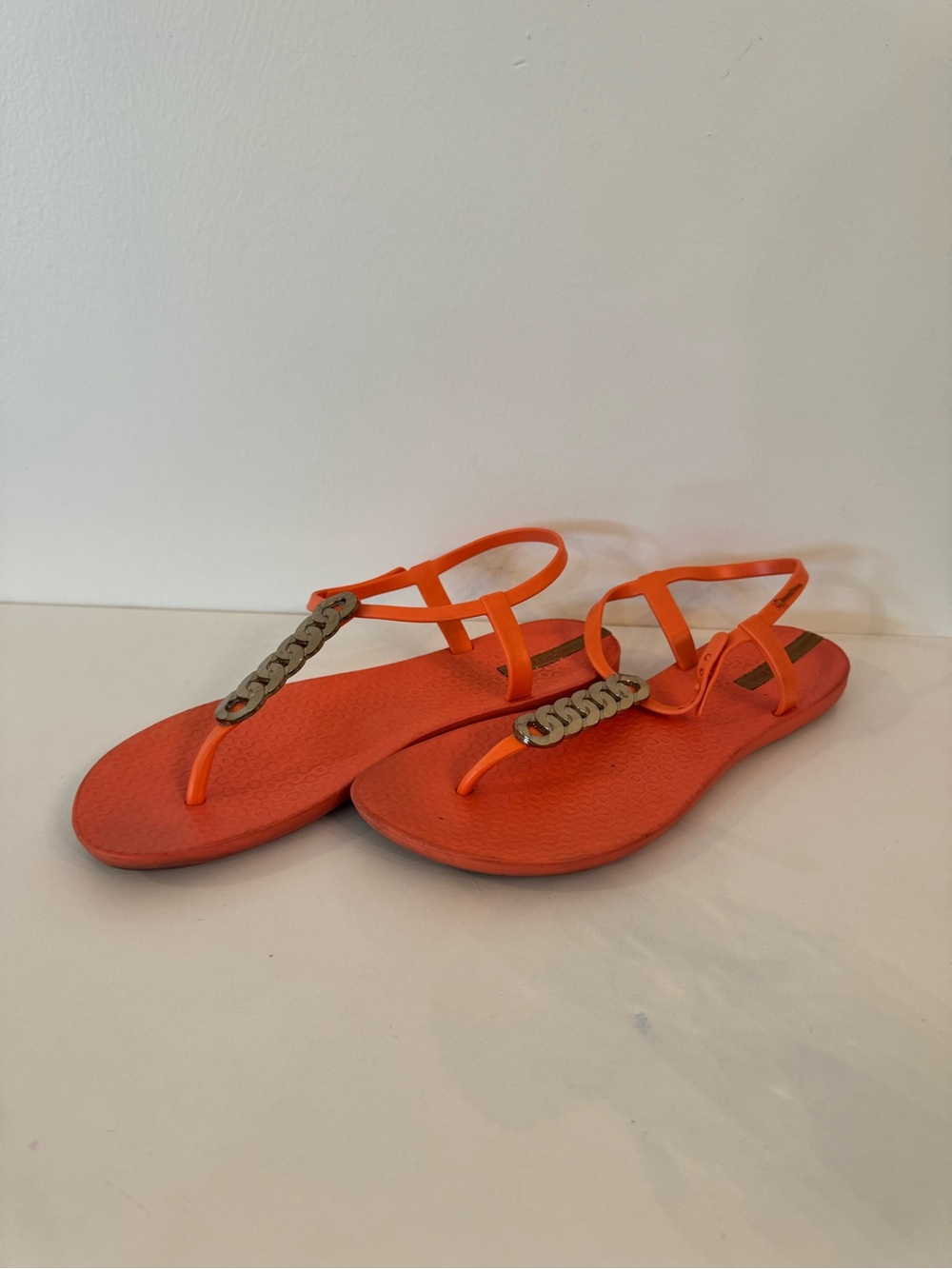 Ipanema Orange T-Strap Sandals with Chain Accent